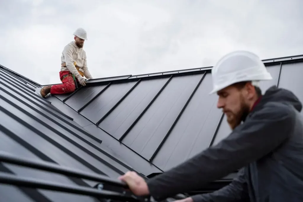 men repairing roof
